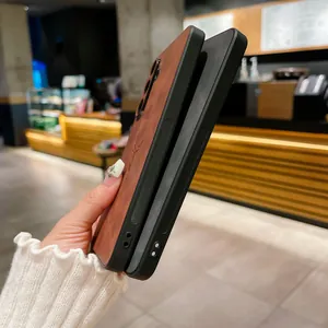 Detailed side view of premium brown faux leather Samsung phone case with embossed deer logo