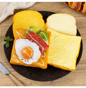 Detail showing a realistic PU simulation toast topped with a fried egg and bacon