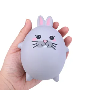 Cute grey rabbit slow rebound squishy toy held in hand to show soft PU foam texture