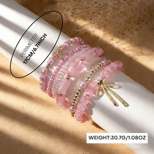 Bohemian pink beaded bracelet set with bow charms and faux pearls, 6.7-inch perimeter