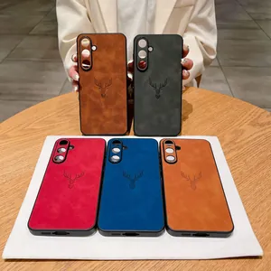 Close-up of various colors of lambskin-textured phone cases with deer head motif for Samsung.