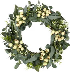 Close-up detail of large eucalyptus wreath with realistic berries for home wall decor