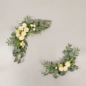 Close-up of cream roses and green foliage for artificial wedding welcome sign decor