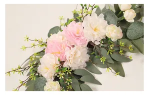 Close-up of elegant artificial pink and white peony swag with eucalyptus leaves