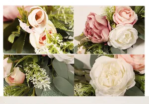 Close-up detail of realistic artificial roses and greenery for wedding welcome signs.