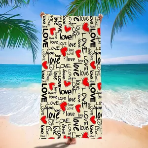 Microfiber quick dry beach towel with red heart and love print in a tropical beach scene