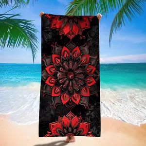 Detailed mandala pattern on quick-dry microfiber beach towel with red and black tones.
