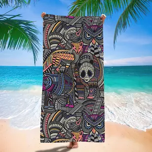 Full view of quick-dry microfiber beach towel with mandala tribal animal pattern.