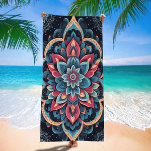 Vibrant mandala pattern beach towel displayed on a sunny tropical beach background
