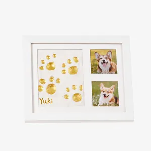 White DIY pet paw print souvenir photo frame kit with personalized gold name engraving