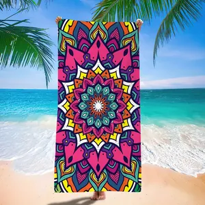 Detailed view of large microfiber beach towel with vibrant colorful mandala pattern