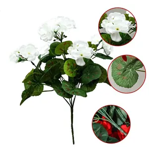 Detailed macro view of artificial white geranium flowers with realistic green leaves