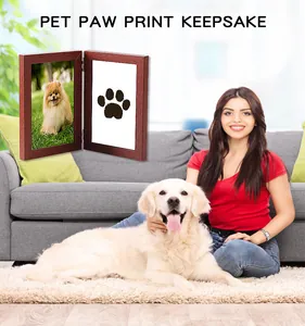 Pet paw print keepsake photo frame shown in a cozy home living room setting