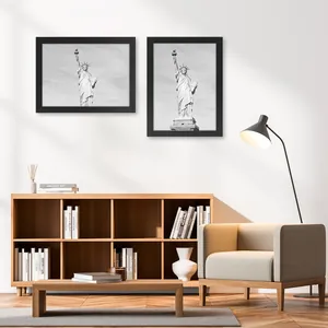 Set of black wooden picture frames displayed in a modern minimalist living room setup