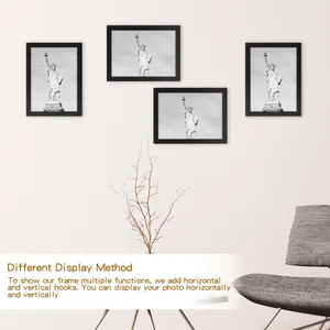 Black wooden photo frames displayed horizontally and vertically on a minimalist wall