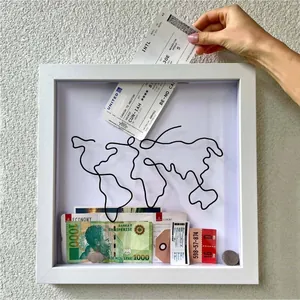White wooden shadow box frame for travel tickets and mementos with world map