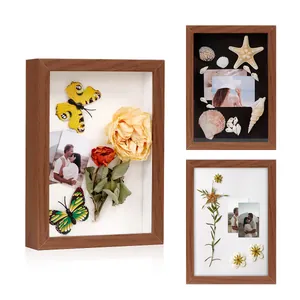 Deep wooden shadow box frame displaying dried flowers and butterflies usage detail