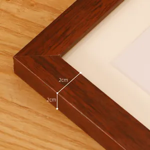 Detail shot of brown wood picture frame corner showing the 2cm frame width and thickness