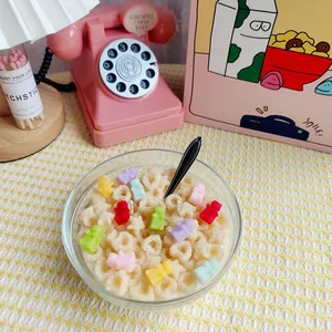 Detail of DIY aromatherapy candle with gummy bear and cereal shapes made from silicone molds