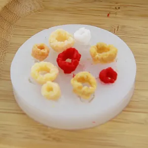 Macro view of a circular silicone mold featuring colorful DIY cereal ring wax melts