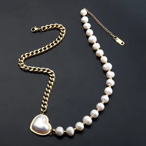 Detailed view of elegant heart pendant necklace featuring gold chain and freshwater pearls
