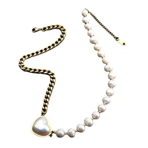 Heart pendant necklace featuring freshwater pearls and gold-tone titanium steel chain.