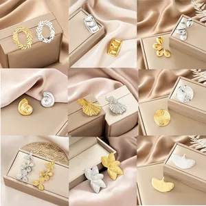 Collection of irregular stainless steel stud earrings in gold and silver finishes