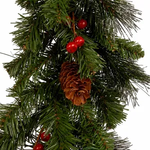 Artificial Christmas garland with green pine needles, pinecones and red berries decoration