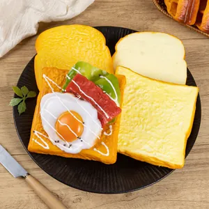 Realistic PU faux toast sandwich model with egg and bacon for display photography.