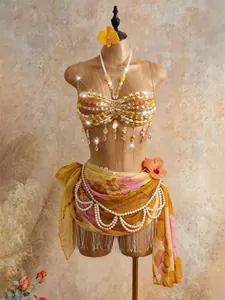 Detailed view of bohemian handmade beaded beach top with floral pearl waist wrap.