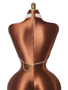 Back detail view of elegant multi-layer pearl and gold chain body jewelry vest top