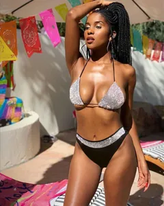 Glamorous high-waisted two-piece bikini set featuring a sequined top and matching waistband
