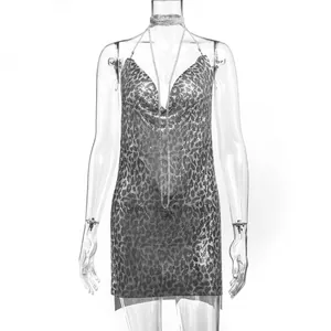 Detailed view of sexy silver leopard print metallic chainmail dress with deep V-neckline