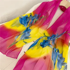 High-quality detail of vibrant spring floral chiffon scarf featuring elegant blue lily print