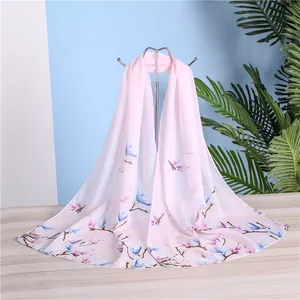 Elegant pink chiffon long scarf with detailed blue and pink magnolia floral print
