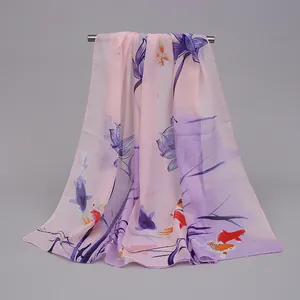 Detailed view of pink and purple chiffon scarf with elegant lotus and koi fish print.