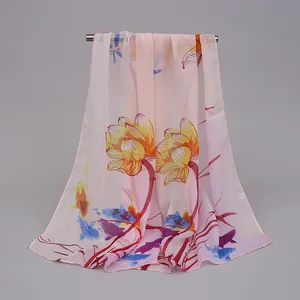 Detailed view of lightweight chiffon scarf with elegant lotus and fish floral print