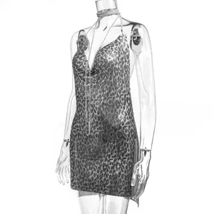 Side view detail of sexy leopard print deep V backless metallic chainmail mini dress