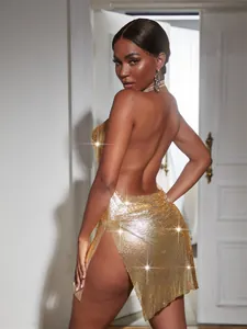 Close-up detail of a sexy backless gold metallic mesh mini dress for nightclub parties