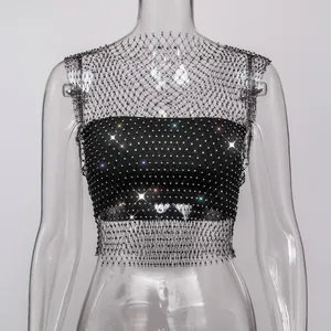 Close-up detail of sexy black fishnet tank top with sparkling rhinestone embellishments