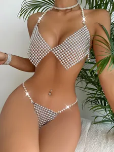 Detailed macro shot of a sexy pearl halter bikini set with silver metallic mesh beads
