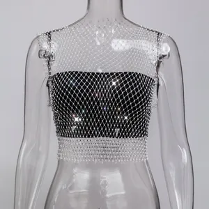 Close-up detail of sexy black bandeau top with sparkly rhinestone fishnet overlay