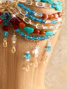 Detailed view of colorful bohemian beaded top with sparkling tassels for beach vacation