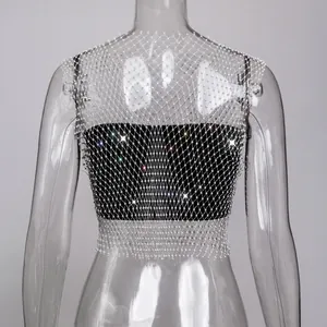 Detailed view of the sparkling rhinestone embellishments on a black fishnet mesh crop top.