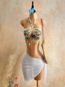 Detailed view of bohemian handmade beaded halter top with tassels for beach vacation