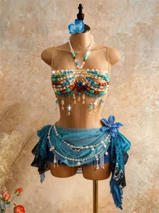 Detail shot of a handmade bohemian beaded bra top featuring turquoise and pearl accents.