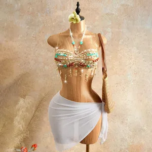 Bohemian handmade beaded halter top featuring colorful stones and delicate fringe tassels