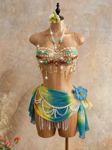 Handmade beaded bohemian halter top with matching sarong on a display mannequin.