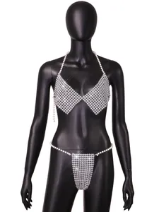 Detailed view of a sexy silver pearl beaded halter bikini set on a black mannequin.