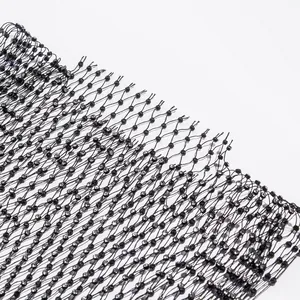 Close-up detail view of black elastic fishnet fabric with sparkling silver rhinestone accents.